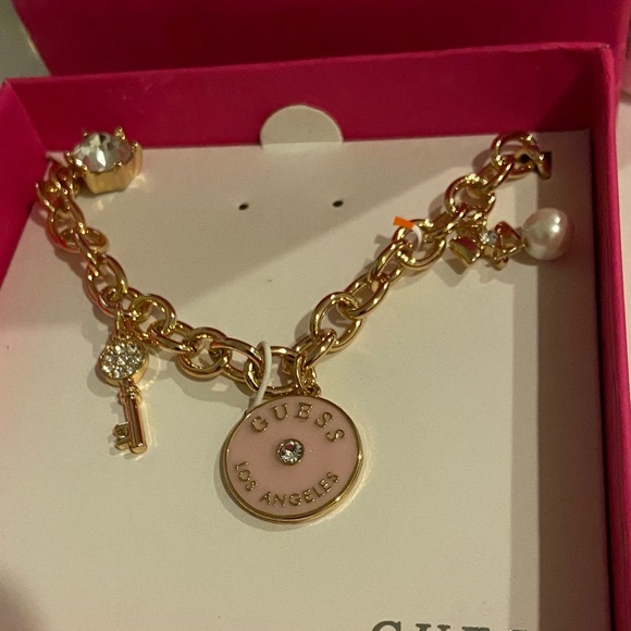 Guess Jewelry - GUESS Gold necklace with Pink Charms